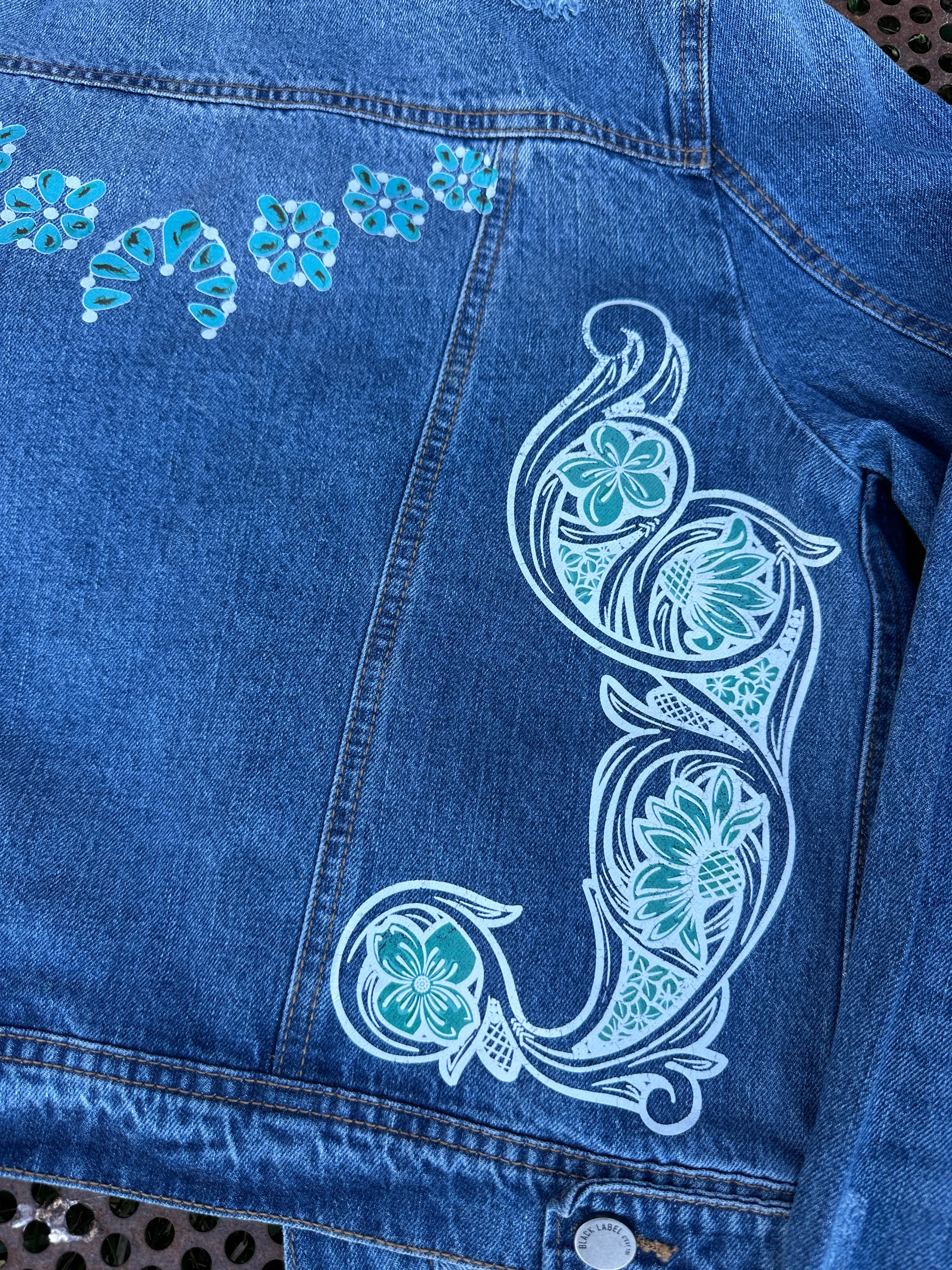 Denim jacket with Squash Blossom and tooled sides.